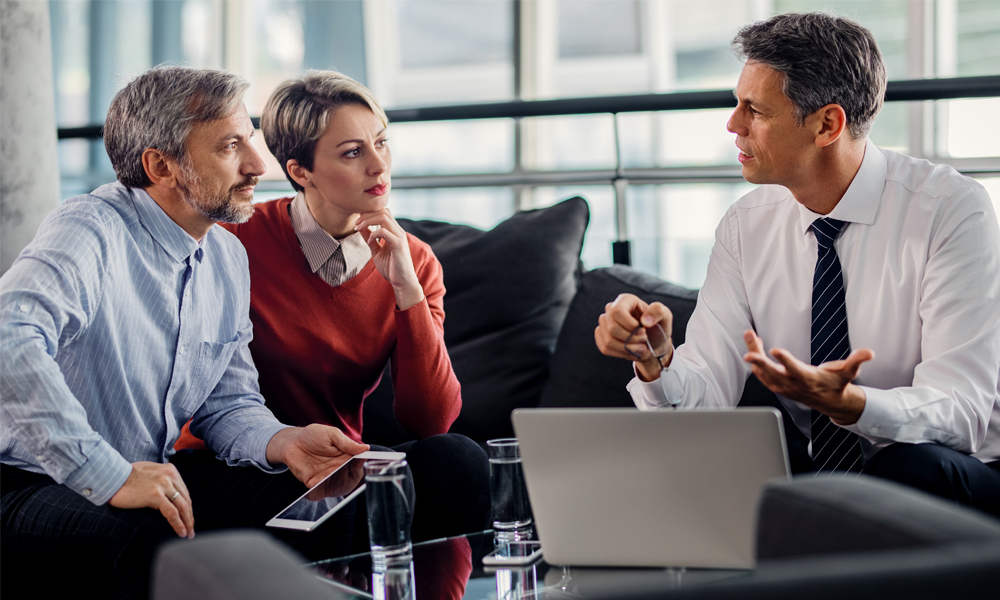 Insurance advisor conducting a beneficiary review.